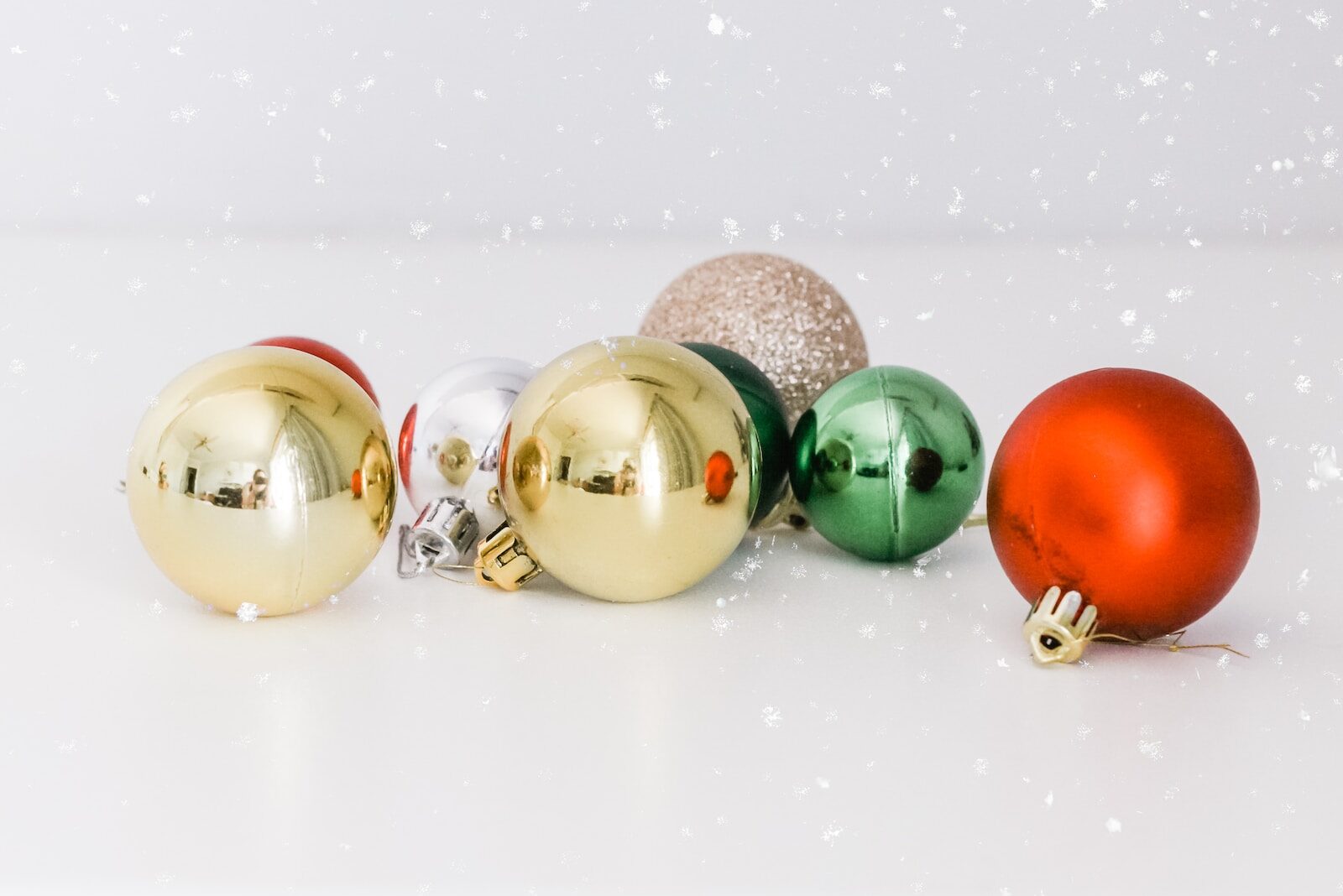 assorted-color baubles on white surface